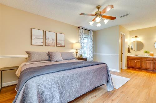 a bedroom with a bed and a ceiling fan at Decatur Vacation Rental with Patio! in Decatur