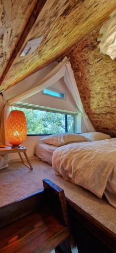 Voodi või voodid majutusasutuse Mini Hill - Tiny House toas