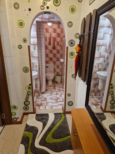 a bathroom with a shower with a toilet and a mirror at Villa Residence, free parking, pets friendly in Varna City