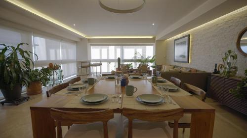 a large wooden table in a living room at 3 Bedroom Apartment in Polanco - best location in Mexico City