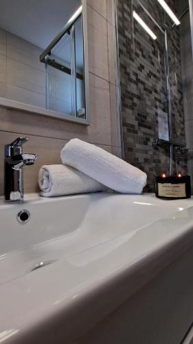 a bathroom sink with two towels on top of it at Belvedere Premium in Novalja