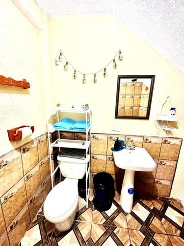 a bathroom with a toilet and a sink at Nicolas House #2 with Lake Atitlán View in San Pedro La Laguna