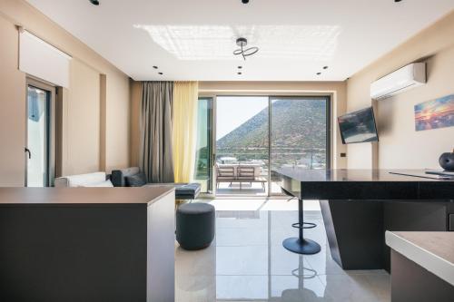 a hotel room with a view of a living room at Isla Villas & Suites in Balíon