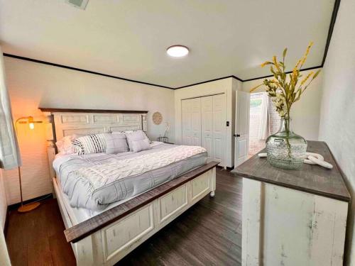 a bedroom with a large bed and a table at small rental for couple getaway in Dalton
