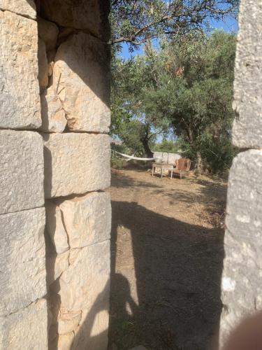 a shadow of a person on a stone wall at Casa Betta in Modica
