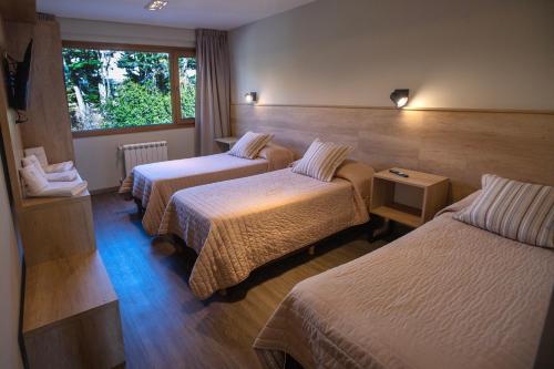En eller flere senge i et værelse på Hotel 7 Lagos