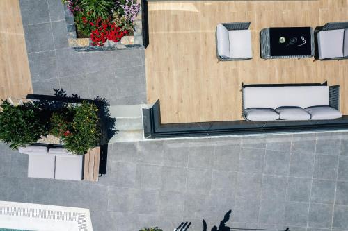 an overhead view of a building with parked cars at Isla Villas & Suites in Balíon