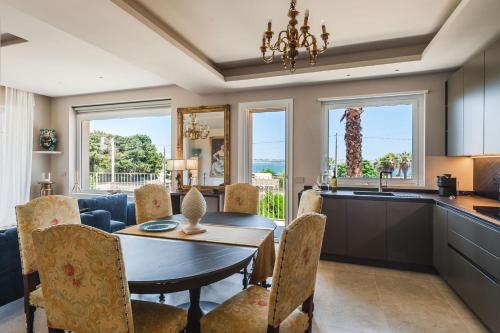 a kitchen and dining room with a table and chairs at 5E Villa Charme-Sea and Ortigia view-Whirlpool roof Terrace in Siracusa