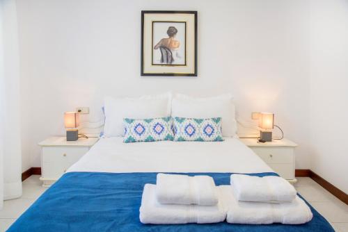 En eller flere senge i et værelse på Apartamento Welcome Parque Panadeira