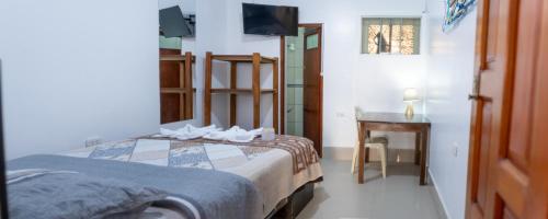 Postel nebo postele na pokoji v ubytování Hostal Mi Peru