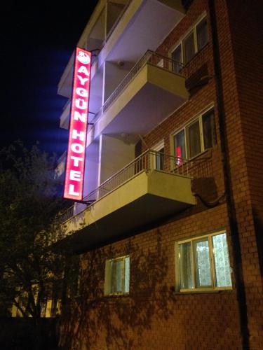 a hotel sign on the side of a building at night at Aygun Hotel Avanos in Avanos