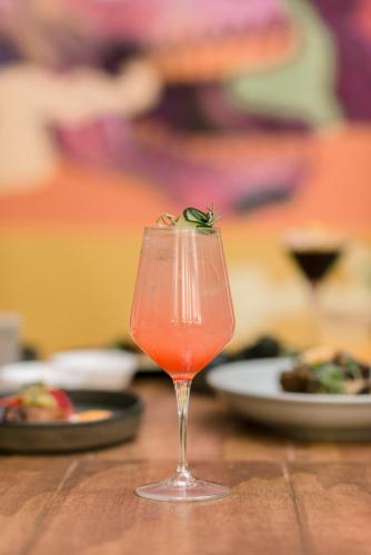 a drink in a glass sitting on a table at Casa Hoyos - Hotel Boutique in San Miguel de Allende