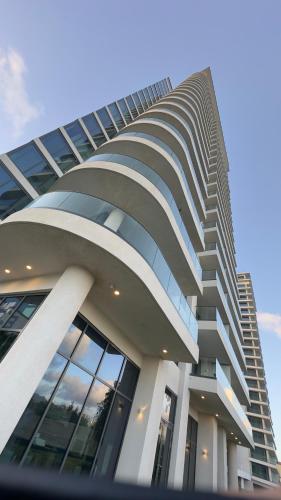 a tall building with a lot of windows at Mullet Bay Suites - Your Luxury Stay Awaits in Cupecoy