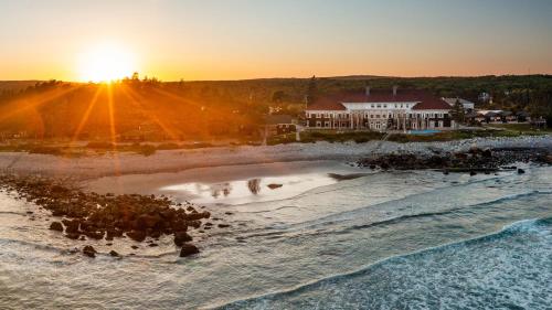 an aerial view of a beach at sunset at White Point Beach Resort in Summerville Centre