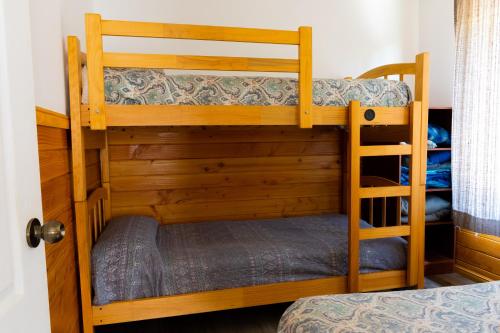 a couple of bunk beds in a room at Cabañas Mirador Lago Ranco in Lago Ranco