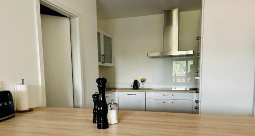 a kitchen with a wooden floor and a counter top at Route du Circuit 23 in Stavelot