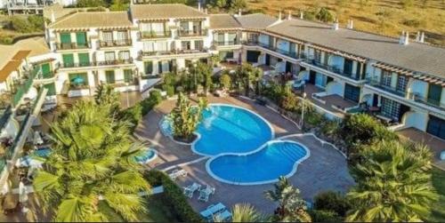an aerial view of a resort with a swimming pool at Condominio Cerro da Guia in Guia