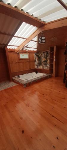 an attic room with a bed in the middle at Casa Mujer Villa Agueda in Chocontá