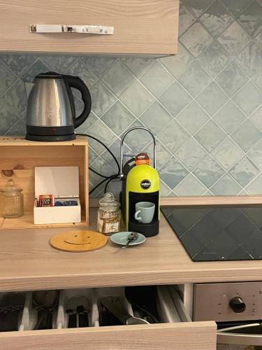 a kitchen counter with a toaster on top of it at Il Gelso Bianco -The White Mulberry Tree in Ravello