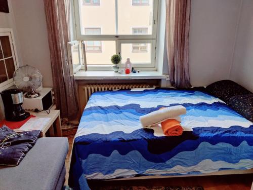 Postel nebo postele na pokoji v ubytování Central apartment in Helsinki