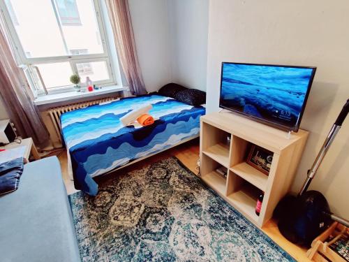 Postel nebo postele na pokoji v ubytování Central apartment in Helsinki