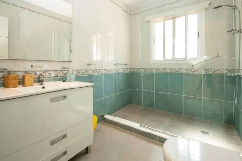 a bathroom with a sink and a bath tub at Villa Fuente Verde in Marbella