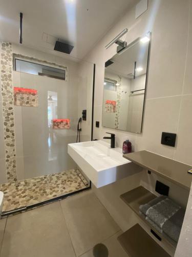 a bathroom with a sink and a mirror at Torrevieja - LaMata - Sonny in La Mata