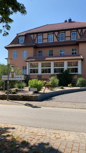 a large building with a street sign in front of it at Haus Brandenburg in Stechlin