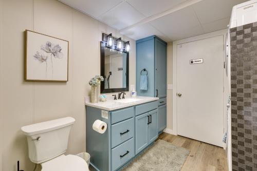 a bathroom with a blue cabinet and a sink at Lake House Haven Fire Pit, Boat Dock and More! in Watauga
