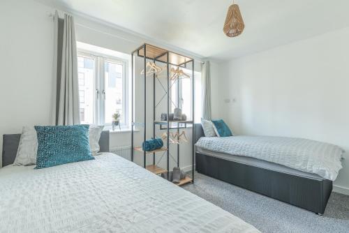 Ένα ή περισσότερα κρεβάτια σε δωμάτιο στο Beautiful New House in Derby For up to 5 Guests, Suitable for Families Contractors NHS Staff etc