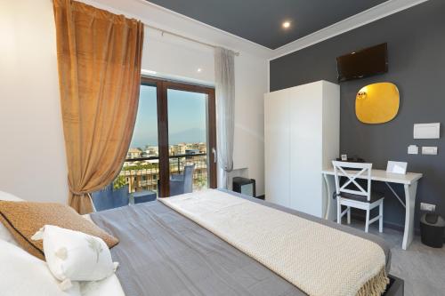 Postel nebo postele na pokoji v ubytování Luxe sur Mer B&B Sorrento