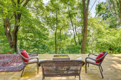 a patio with a table and chairs and trees at Private Catskill Mountains Vacation Getaway in Leeds