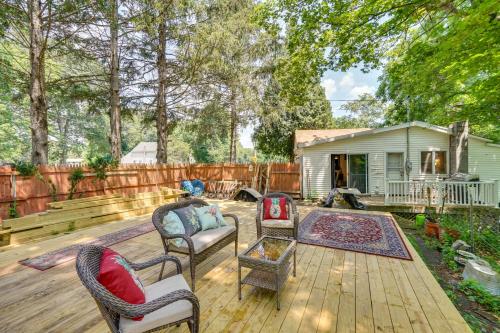 a patio with chairs and a fence and a house at Private Catskill Mountains Vacation Getaway in Leeds