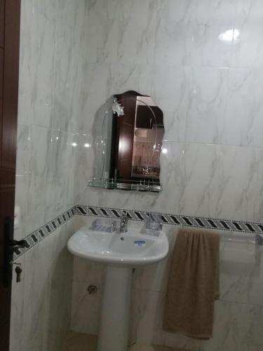a bathroom with a sink and a mirror at Cabo Dream a Cabo Negro in Cabo Negro