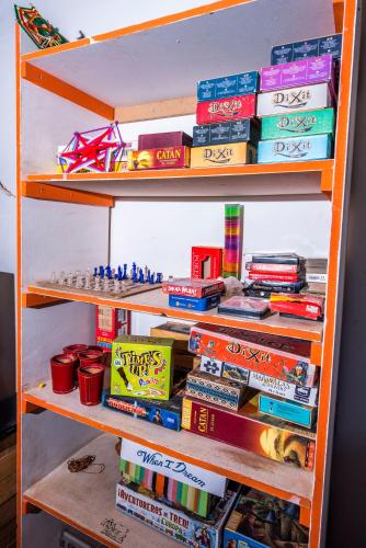 a book shelf filled with lots of books at Casa Voyage Hostel in San Pedro de Atacama