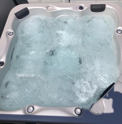 a bath tub filled with water in a sink at Carline in Le Diamant