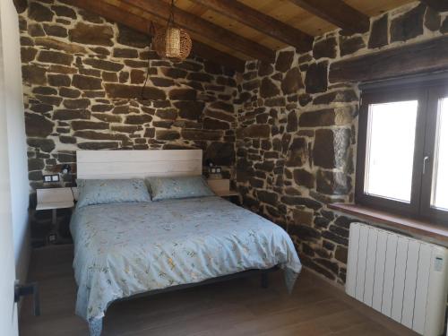 Ένα ή περισσότερα κρεβάτια σε δωμάτιο στο Casa Rural El Picón
