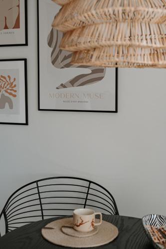 a cup of coffee sitting on a table at BALI apartment in central Mažeikiai SELF CHECK-IN 24H in Mažeikiai