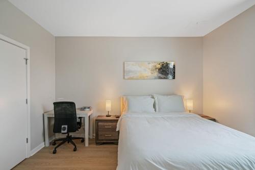 a bedroom with a bed and a desk with a computer at Cityscape Haven Views Close to DC in Arlington