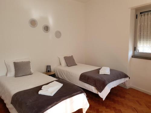 Postel nebo postele na pokoji v ubytování Casa da Avó Laurinda