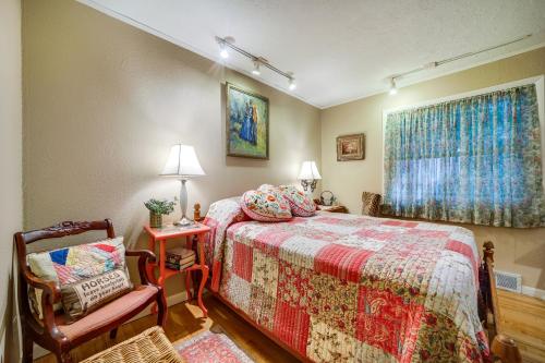 1 dormitorio con 1 cama, 1 silla y 1 ventana en North Carolina Abode with Fire Pit and Mountain Views!, en Sylva