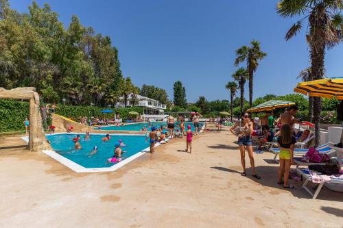 a group of people in a pool at a resort at Villaggio Costa d'Argento in San Vito Chietino