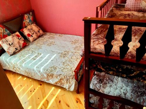 a bedroom with a bunk bed and a staircase at Villa ELO in Kebele in Gabala