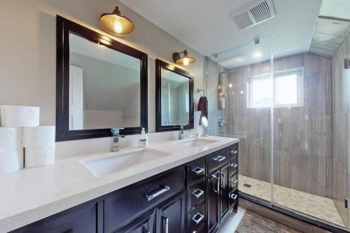 a bathroom with a double sink and a shower at Hidden Farm Escape in the Heart of Kawarthas in Beaverton