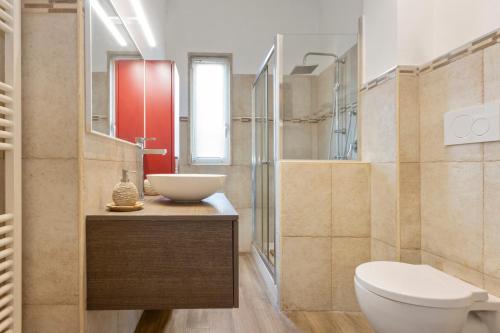 a bathroom with a toilet and a sink at Loft Corso Trieste in Bari