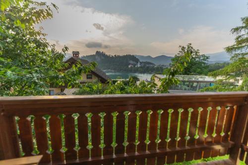 a wooden railing with a view of a river at Villa Anna in Bled