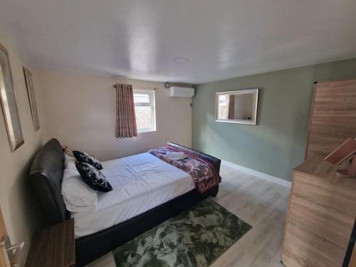 a small bedroom with a bed and a window at Perfect for exploring Birmingham in Birmingham