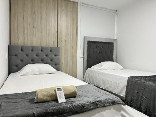 Postel nebo postele na pokoji v ubytování Río Guatapuri y Confort Deluxe