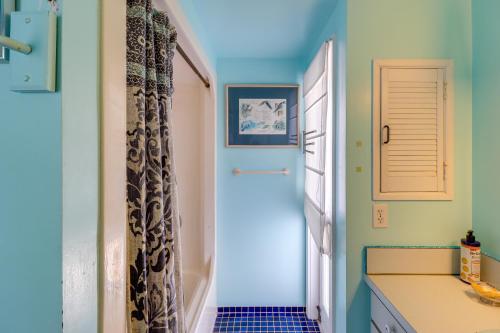 a bathroom with a door leading to a hallway at Key West Paradise with Private Pool and Ocean View in Cudjoe Key