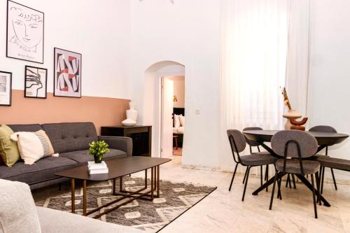 a living room with a couch and a table at Mamilla View- Suites & Apt Hotel in Jerusalem